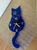 Image of Wall clock with original design of a cat with stars blue silver numbers and white arms kids bedroom home decoration