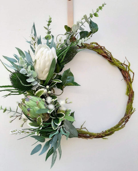 Green and white wreath. Protea, thistle, eucalyptus. Australian christmas wreath, door decoration. Mossy vine wreath.