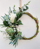 Image of Green and white wreath. Protea, thistle, eucalyptus. Australian christmas wreath, door decoration. Mossy vine wreath.