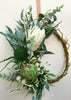 Image of Green and white wreath. Protea, thistle, eucalyptus. Australian christmas wreath, door decoration. Mossy vine wreath.